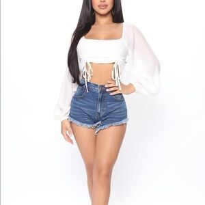 Fashion Nova denim shorts.